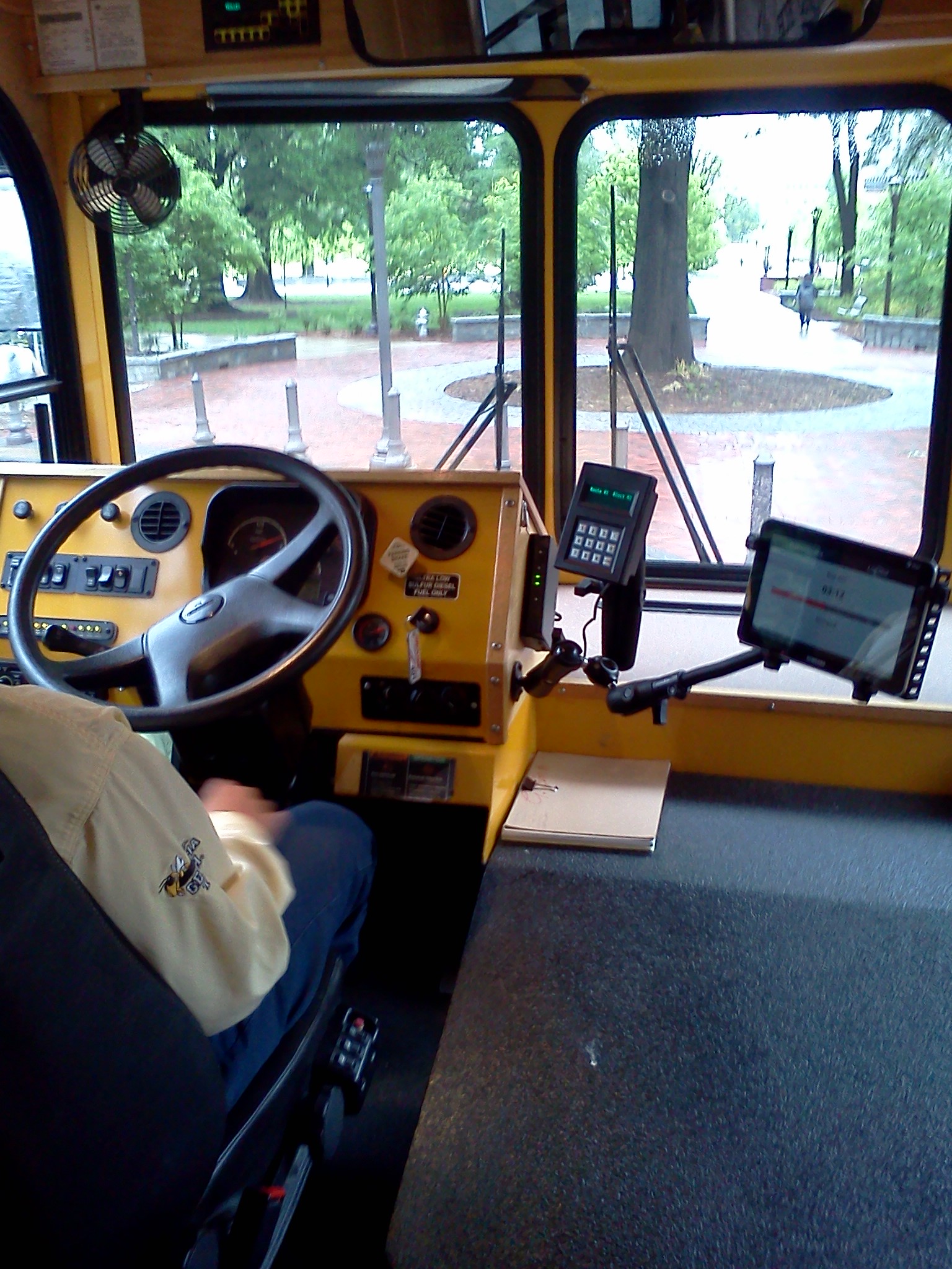 Tablet computer mounted beside bus driver Tablet computer mounted beside bus driver