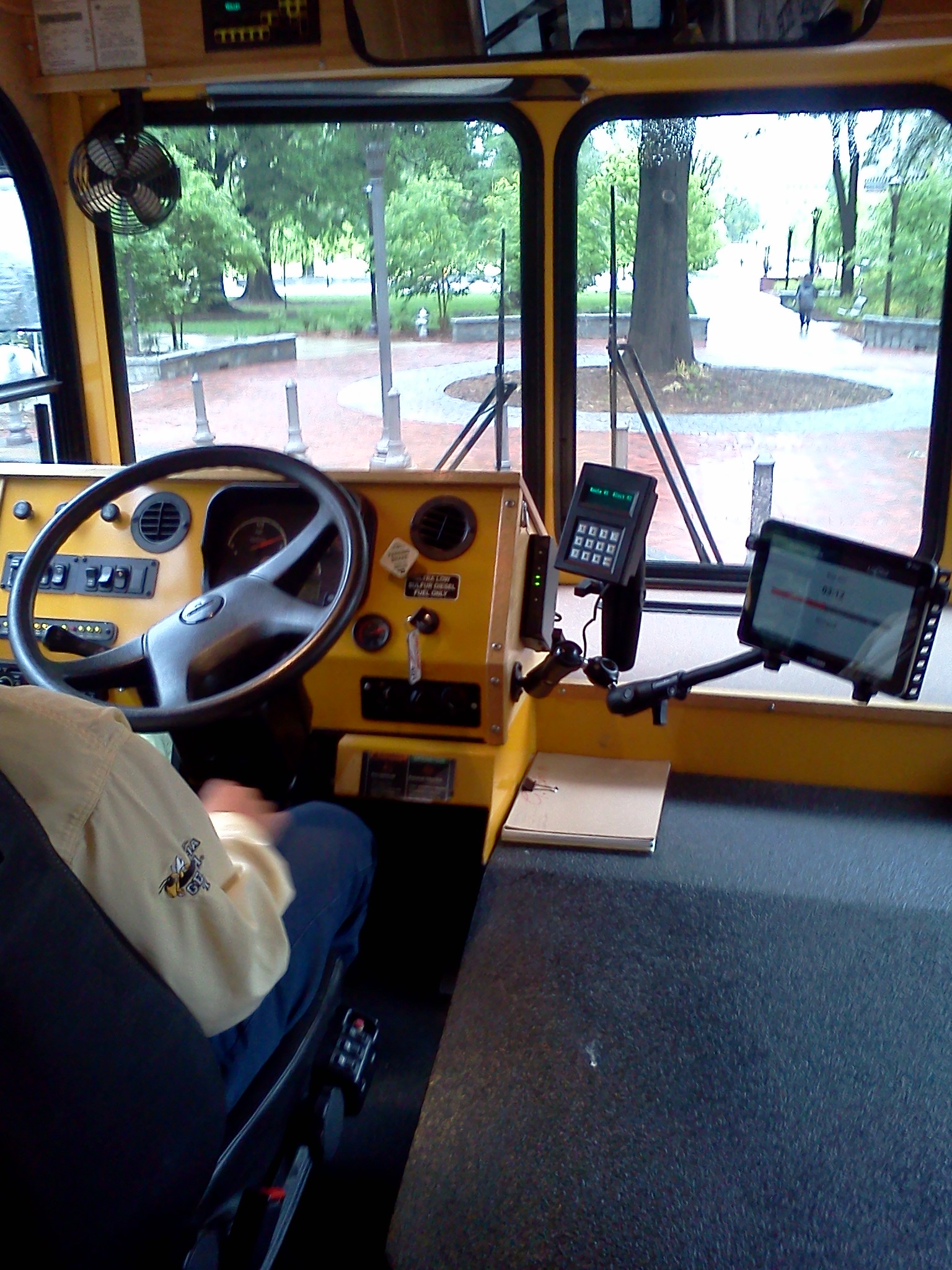 Tablet computer mounted beside bus driver